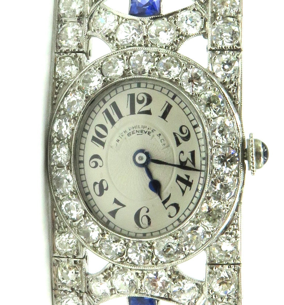This is the most beautiful art deco bracelet ever! With arguably the best watch maker in the world, Patek Phillippe. You just can't get better than this!!! 
The mechanical movement, working perfectly, is centering on an oval off-white guilloche