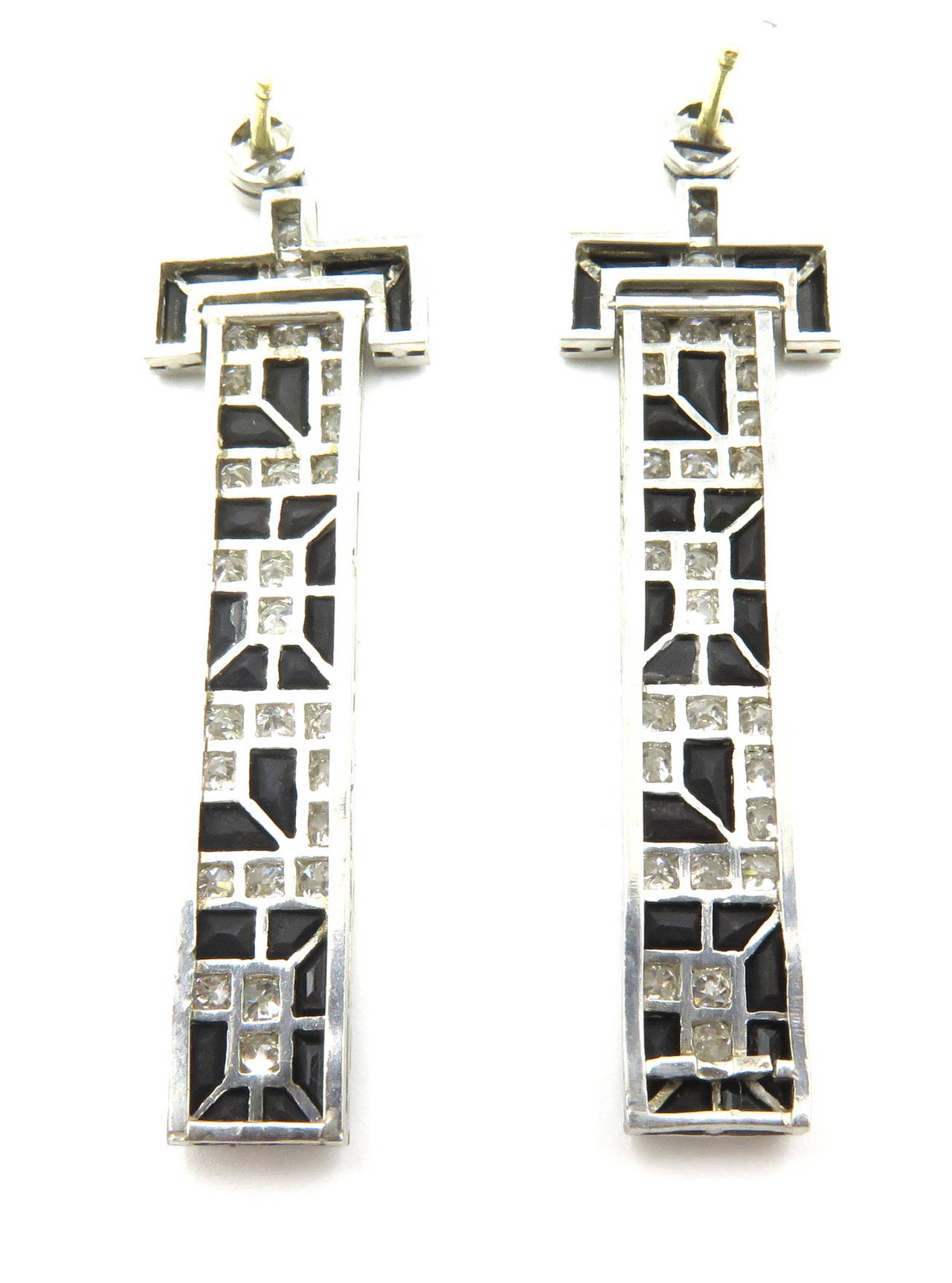 These very well articulated earrings have a somewhat modified Greek Key design. The top portion of the earring can fold back for flexibility. These post earrings are 1 3/4