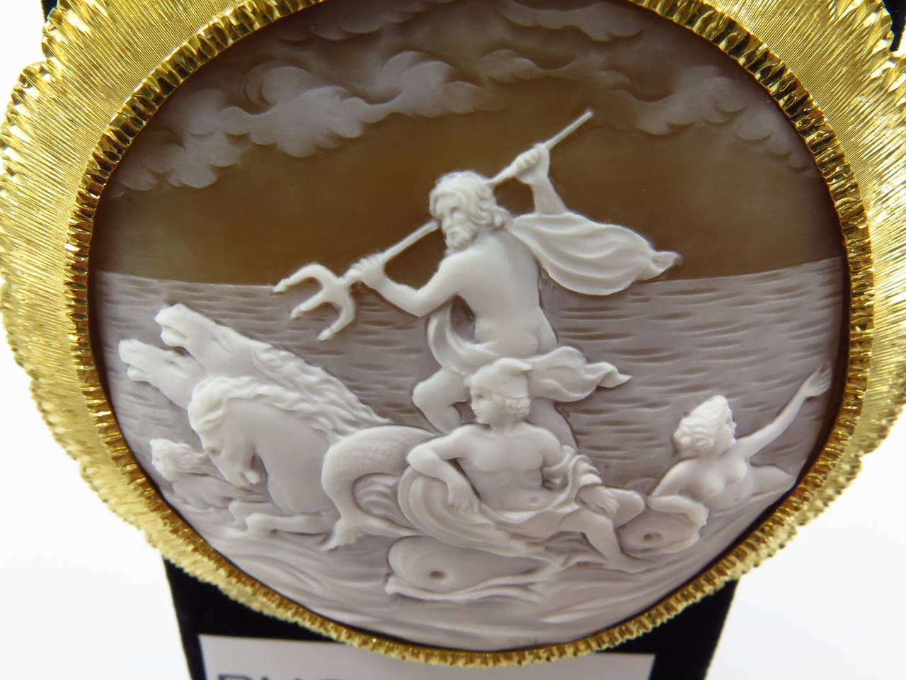 Even if this wasn't signed Buccellati, it would still be the largest most detailed well carved shell cameo I've ever seen. It is 3 inches round depicting Neptune with horses and nymphs swimming and riding dolphins under clouds. There is a hairline