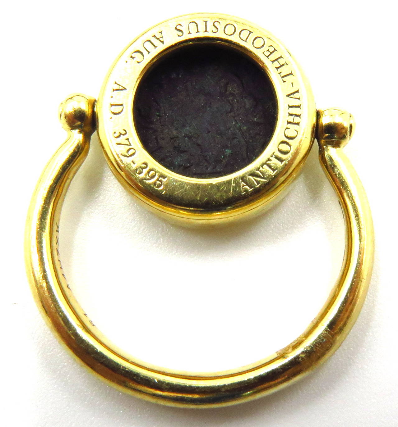 This timeless 2 sided Bvlgari ring from the Monete collection is a flip/spinner ring. It is offered with all the original paper work and boxes shown in pictures. This ring is a size 6. The ancient coin is Antiochia-Theodosius Aug. A.D. 379-395.