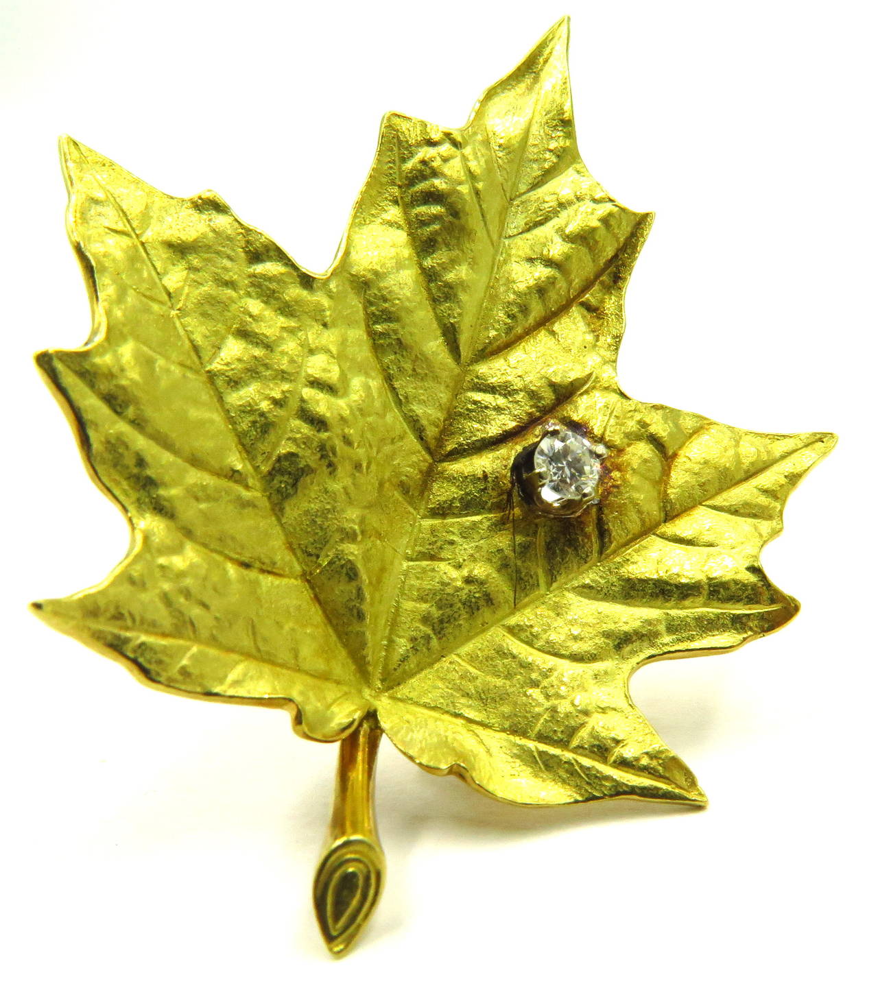This 18k Tiffany maple leaf pin/clip has beautiful detail! It is signed Tiffany & Co on the back. It weighs 11.6 grams. and is 1 7/8