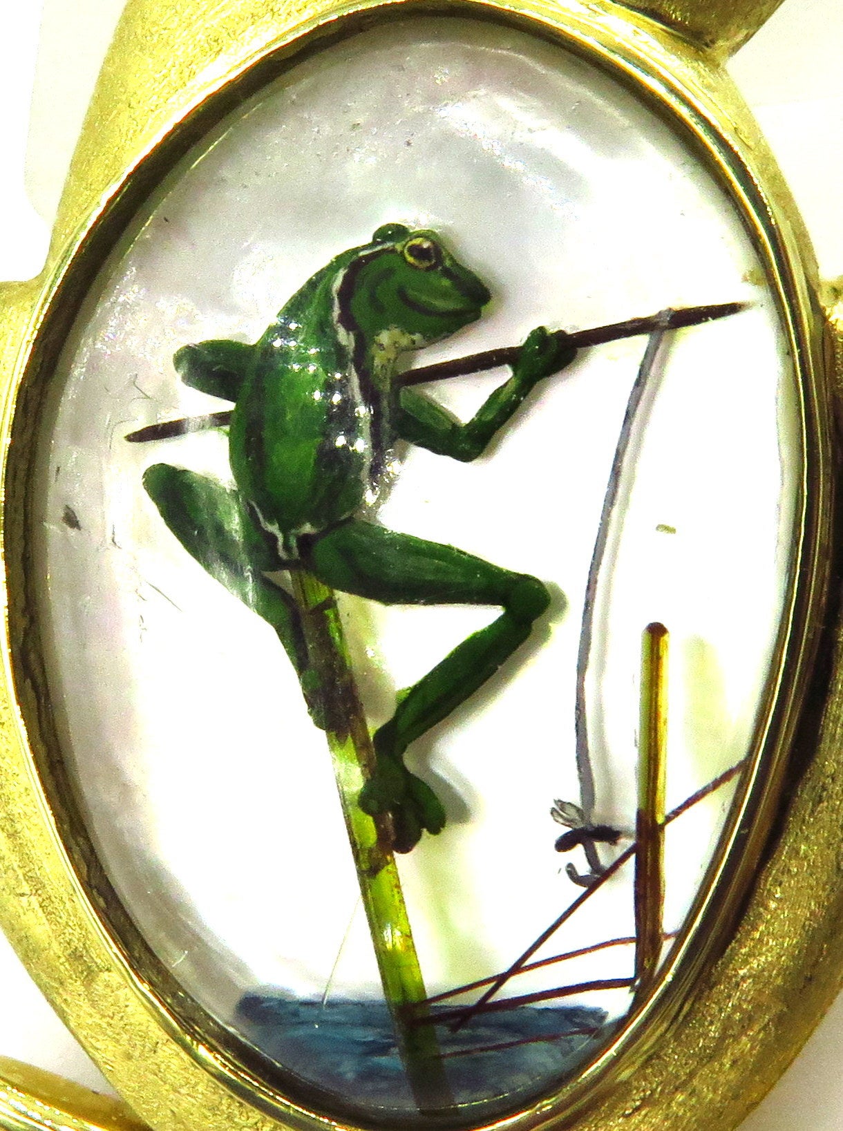 So much character!!! This is a very happy frog with emerald eye, fishing inside of another happy frog enjoying his day!
This large very well articulated double clip type of pin with is 2 5/8