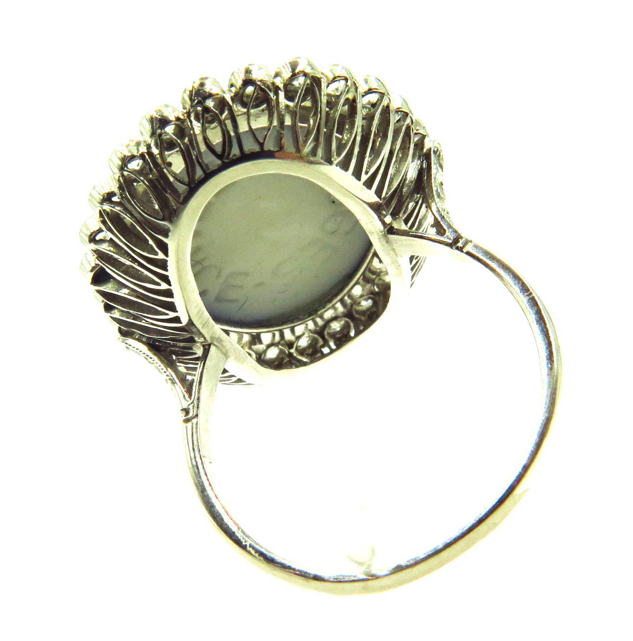 This platinum ring has 27 bezel set diamonds surrounding the Limoges and 3 diamonds on each side of the rings shank. The underside of this ring is signed Limoges - France. The ring shank is marked PLAT
This ring is a size 7 1/4 and can easily be