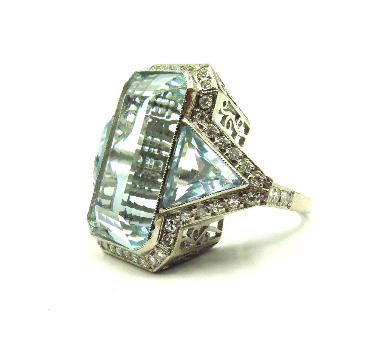 This incredible platinum 3 stone aquamarine ring is very impressive on the finger. The center aquamarine is approximately 30 ct. The diamonds go all around the perimeter of this ring and total total diamond weight is approx 1 ct. The detail on the