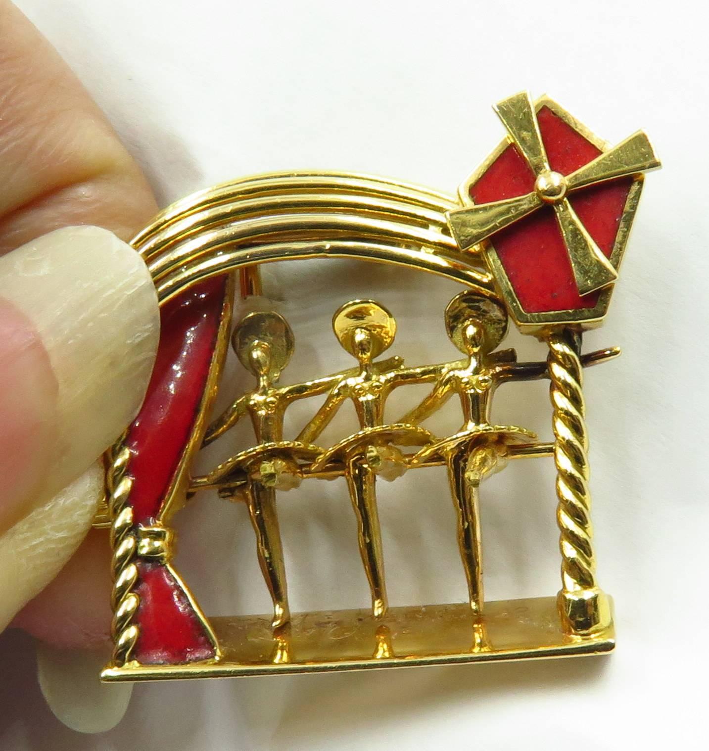 This art deco French pin is the most superbly designed, yet classy/kitschy, unisex pin in the history of the world...(in my humble opinion that is). Turn the knob (looks like a crown on a watch) to the left of the girls to make them kick their legs.