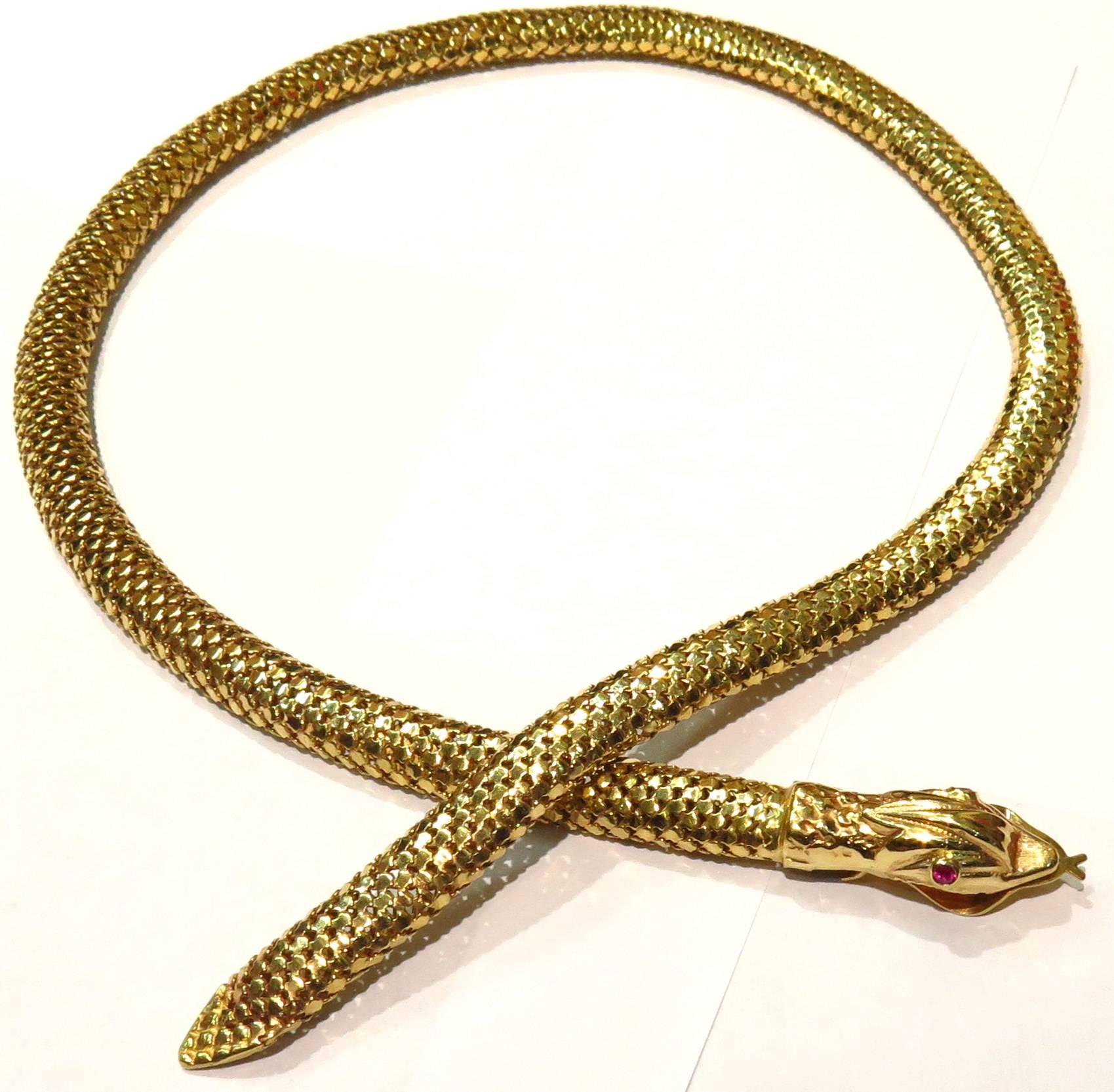 This easy to wear 18K snake necklace will never go out of style. The snakes mouth has a spring mechanism that when pressed, opens the mouth. You then easily place the tail to the desired length around the neck. (see image #7). 
This necklace is