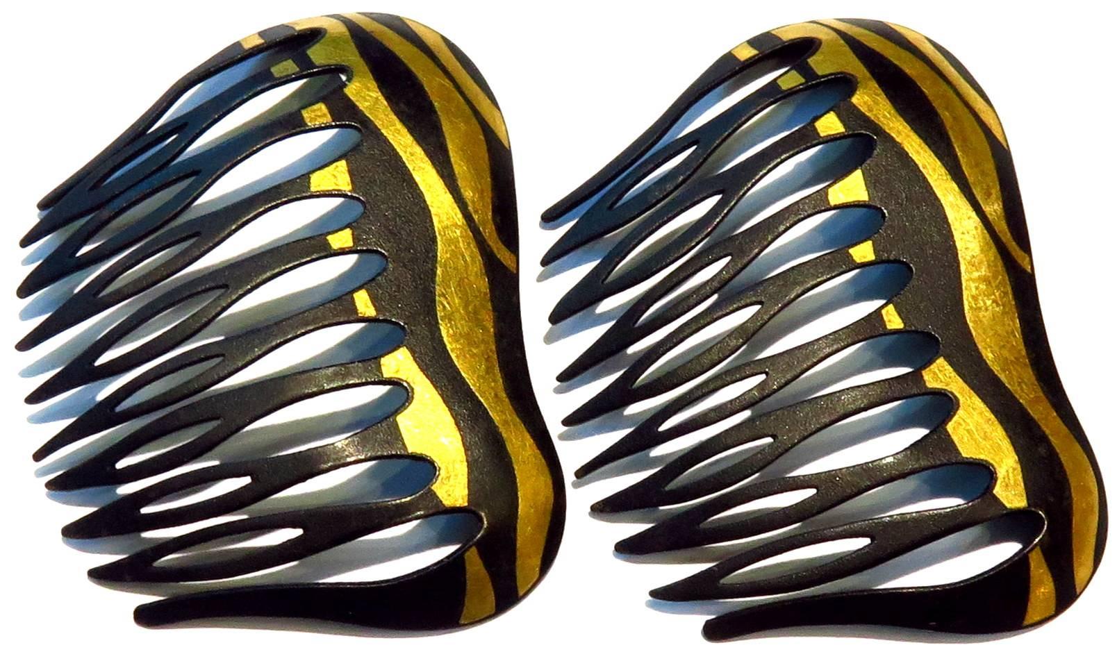 This wonderful pair of hair combs look so chic on that you'll want to wear them everyday! 
They measure 2 5/16 inches across by 1 3/4 inch high
They weigh 20.5 grams
They are signed T & Co on the back of each one. Refer image 6 and 3
t
