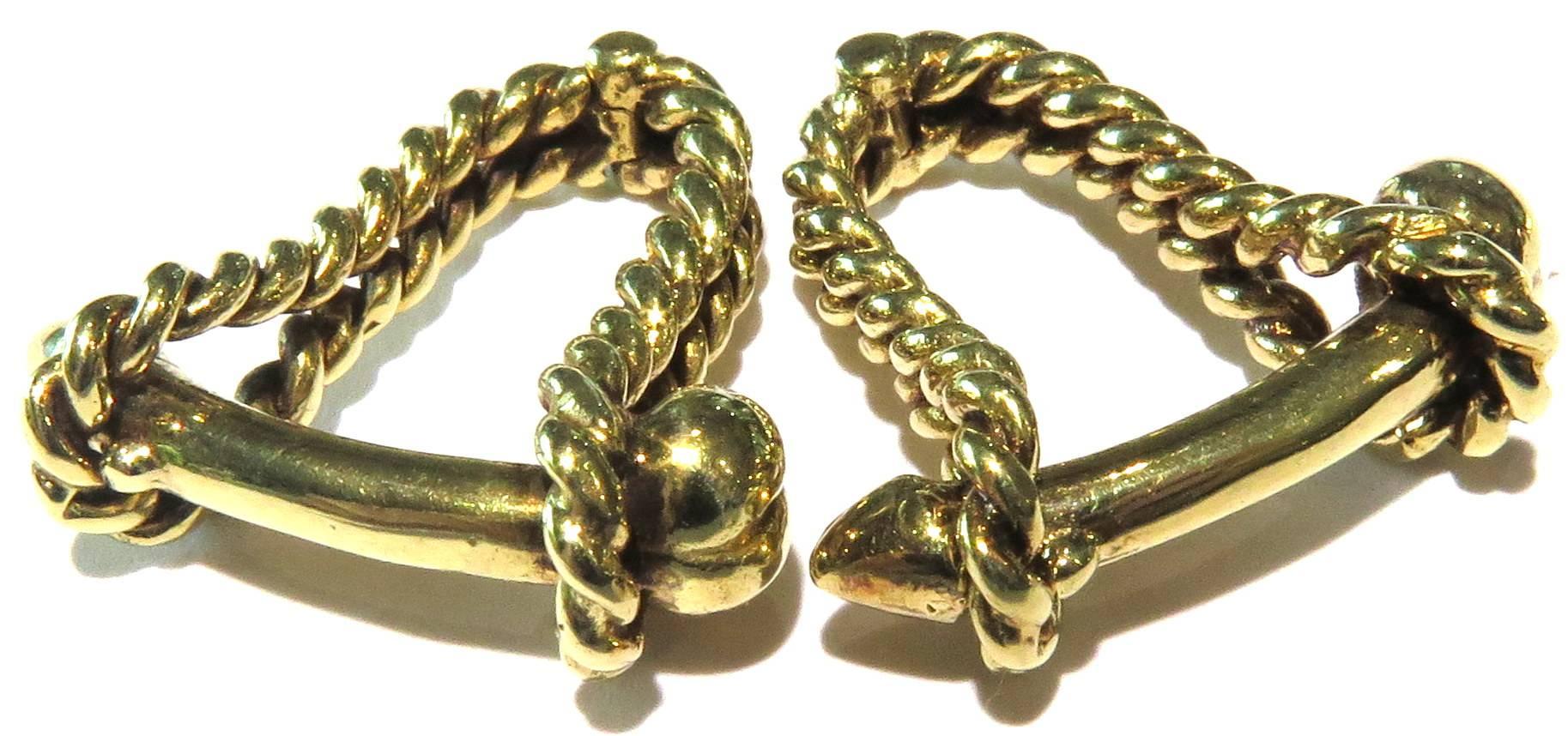 These unique cufflinks are 14k yellow gold.
They weigh 11.6 grams
They measure 15/16 inch cross the shaft
