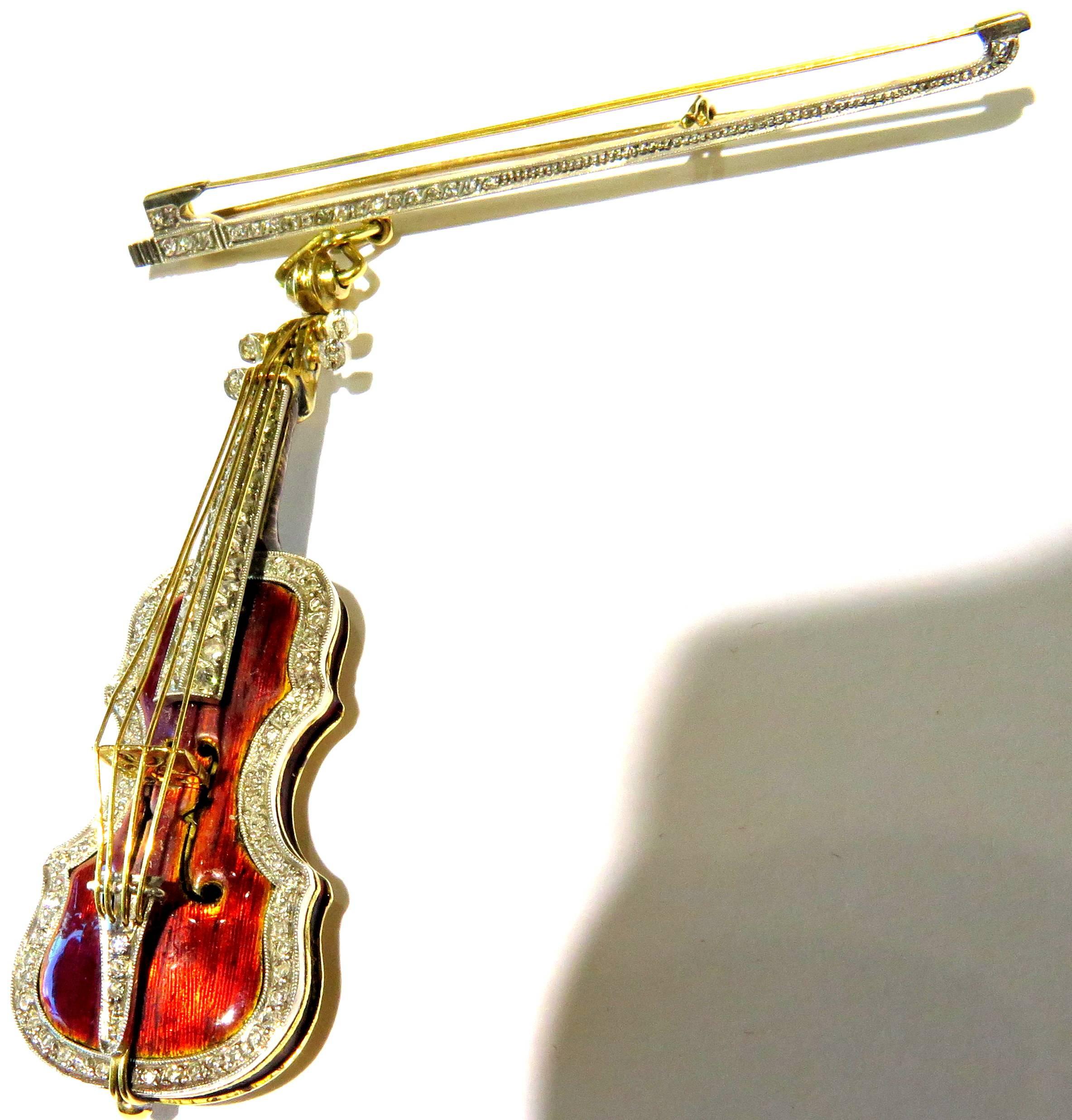 You don't have to play the Violin to look like you do. This amazing 18k pin is made to perfection! The enamel looks like a rich wood grain. The diamonds are across the bow and accenting the frame and neck of the violin. Very few of these violin