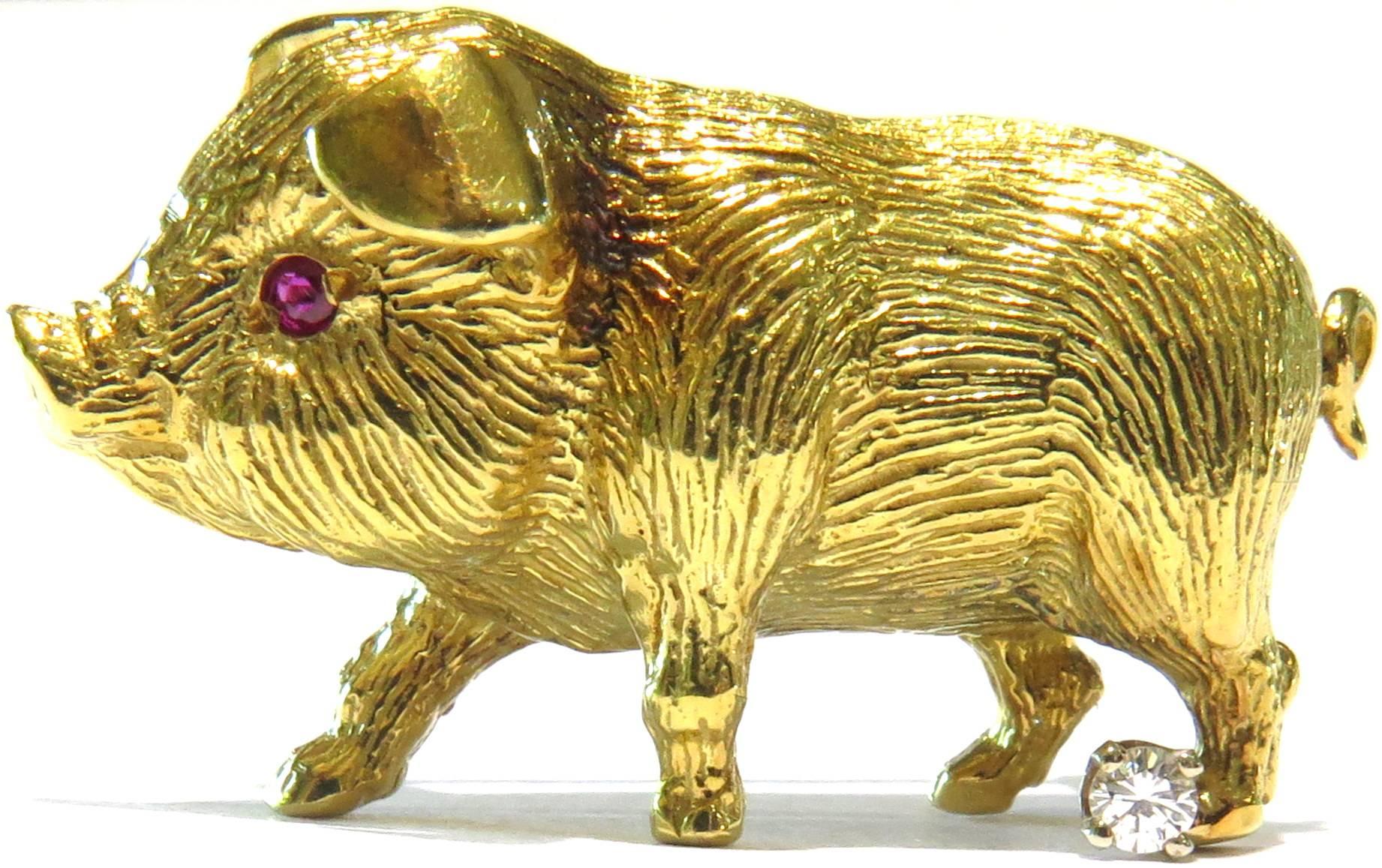This handsome little dude is pretty irresistible....of course I say that because my French Bulldog has been mistaken for a pig 6 times now.....
This sweet pig is 18K gold with 2 ruby eyes and a prong set diamond on his back leg. He even stands up