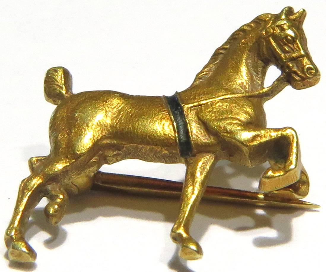 This adorable little horse pin can be worn as a lapel pin or a childs pin. It's the smallest cutest pin I've ever seen!
This art deco Sloan & Co 14k gold horse pin is beautifully detailed and has a very rich patina. The signature for Sloan