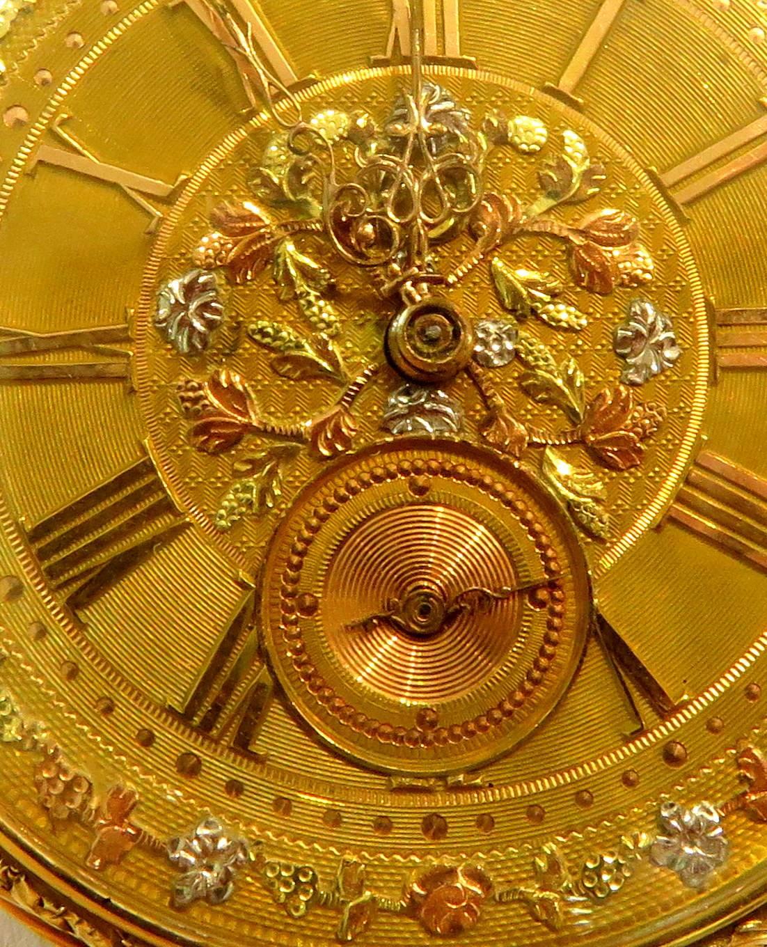 This pocket watch would make the most elegant pendant or charm!. This French pocket watch is all 18k, even the face with the hand applied flowers in rose, white, and yellow gold. It has the original key and is able to wind and change the time, but