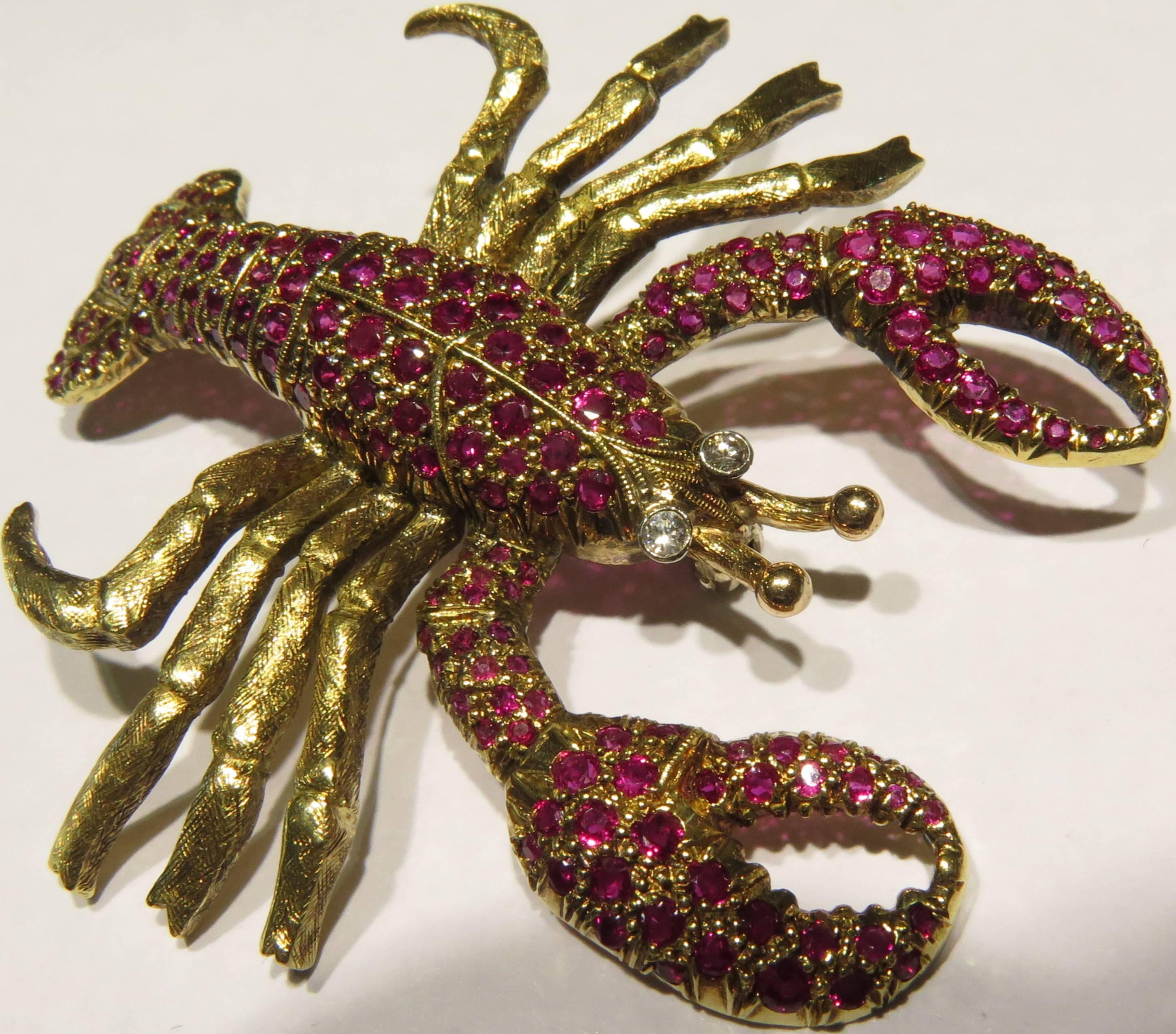 This luscious lobster is thrilled to be spared from your plate and is all about showing off your lapel. It is set in 18k gold and has a brushed type textures to his thick yummy little legs. (Can you tell I'm a New England girl?
This lobster weighs