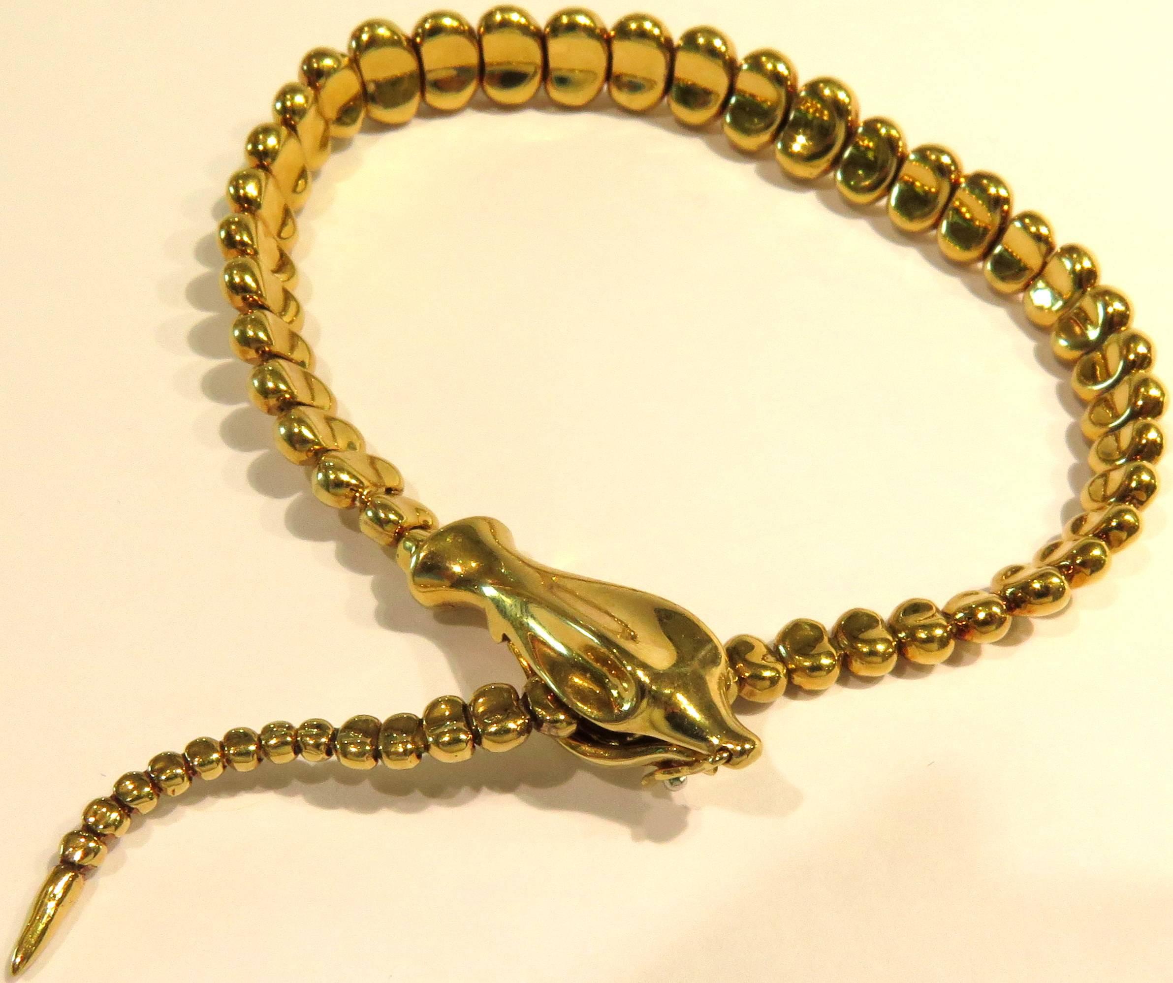 This versatile and chic Tiffany 18k lariat snake bracelet is adjustable enough to fit from a tiny wrist, up to 7 1/2 inch wrist comfortably. The clasp in the snakes head, allows the bracelet to fasten securely at diffent lengths. There is a safety
