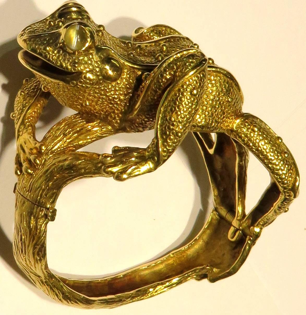 You will never feel alone when wearing this amazing frog bracelet. This 18K gold hinged bangle bracelet is by Craig Drake. He is absolutely life size with incredible detail. His eyes are chrysoberyl cats eyes with such a strong sharp realistic eye