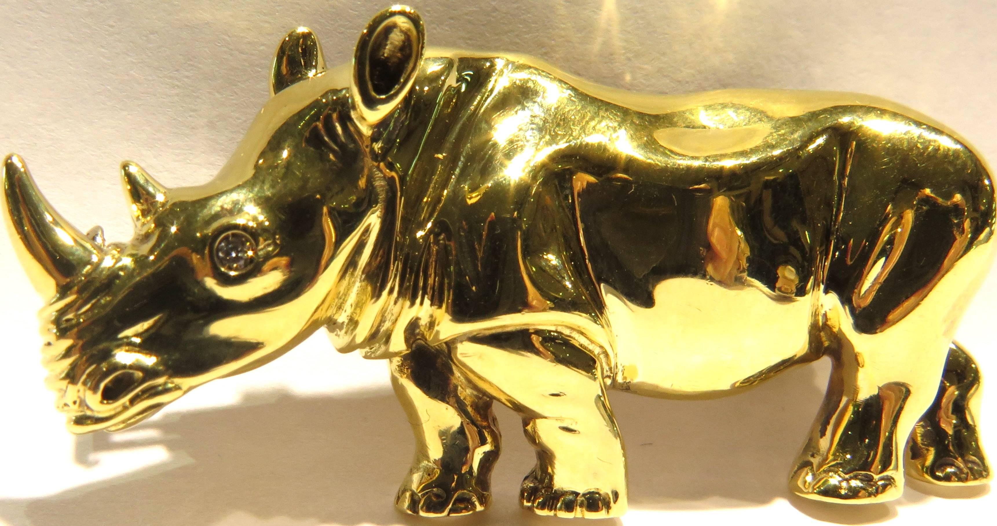 This amazing large rhino pin is set in 18k and contains 1 diamond eye. He measures 2 1/8inch wide by 1 1/8 inch high.
This pin weighs 23.3 grams.
