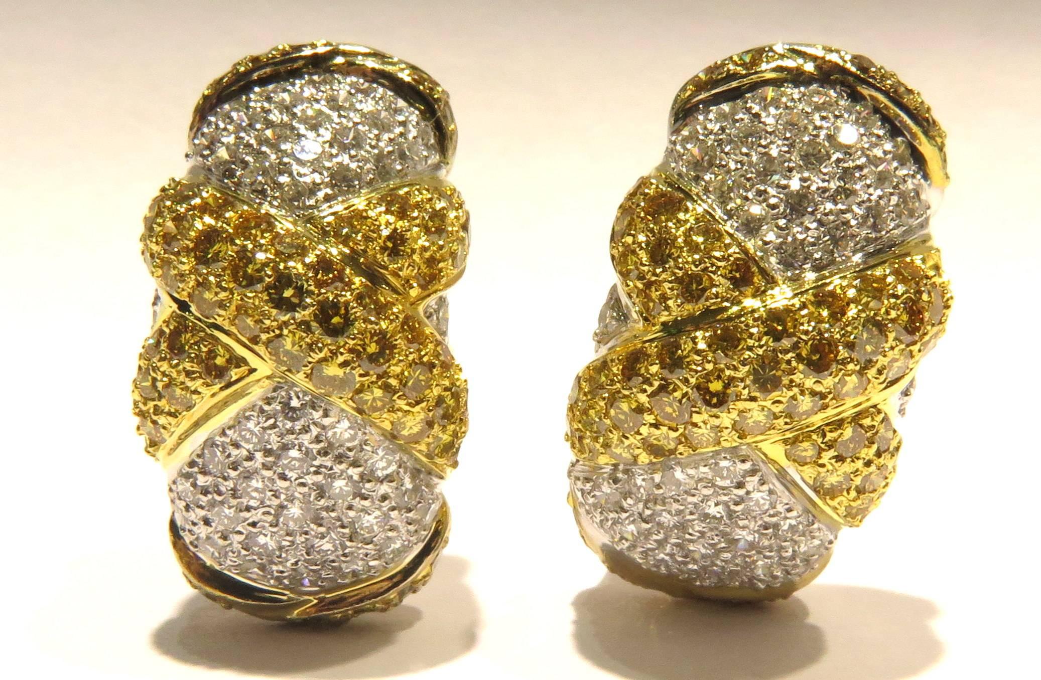These very easy to wear 18k gold X earrings can be a staple in your wardrobe. There are approx 2.60ct  of yellow & white diamonds. These earrings have lever back closures. 
These earrings weigh 17.8 grams
These earrings measure 1 inch long by