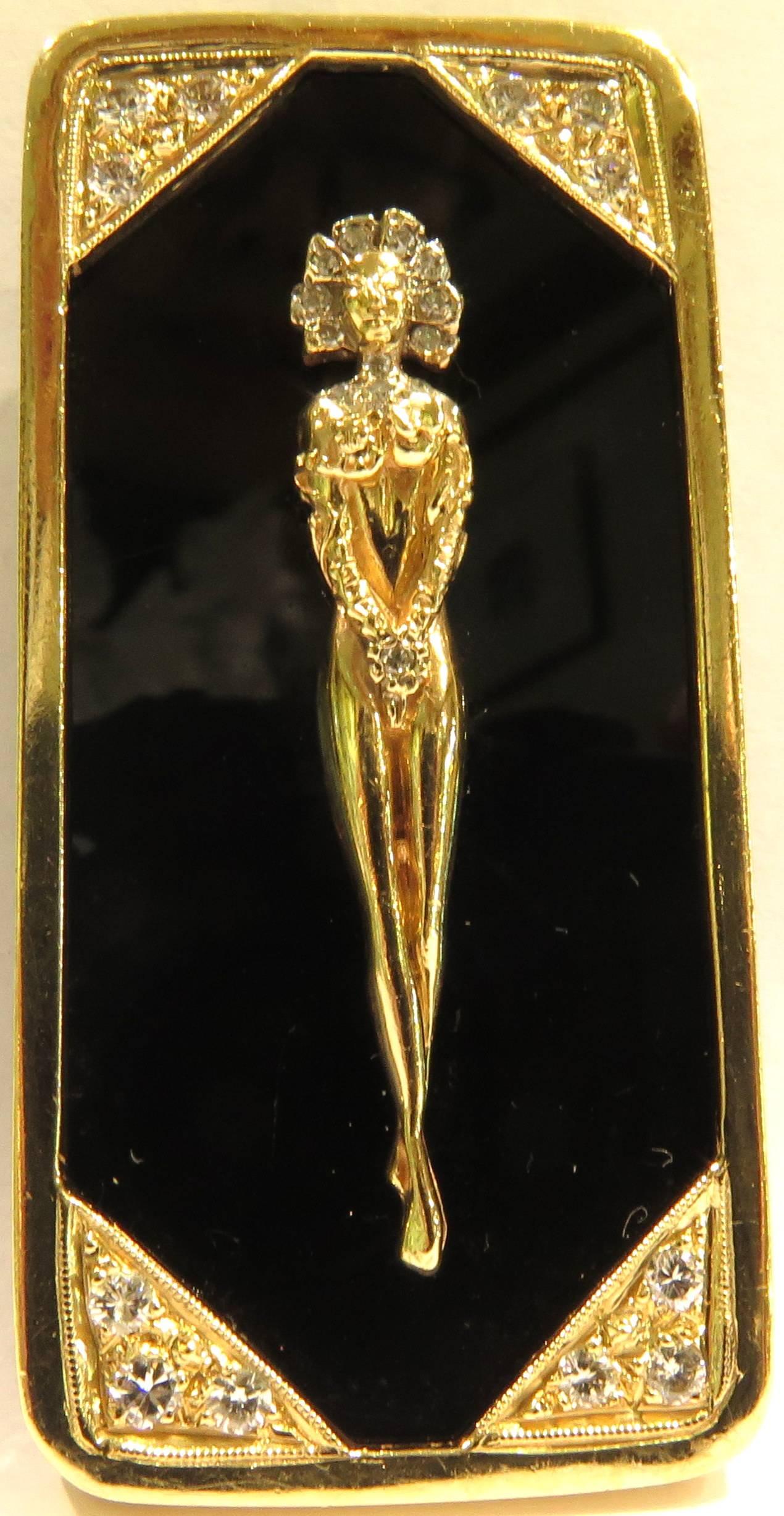 This14k elegant nude woman pin pendant is accented in each corner with diamond curtain corners. The back has a retracting bale for switching the pin to a pendant. 
This pin pendant measures 2 1/4 inch high (not including bale in up position) by 1
