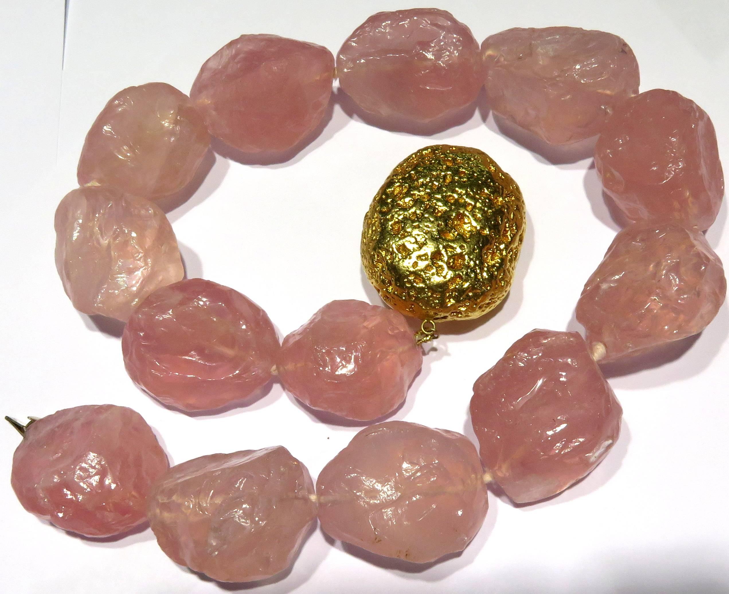 This Sergio Elefante 18k rose quartz necklace is about as bold as they come! Rumor has it Wilma Flintstone, of THE Flintsone's of Bedrock once owned this incredible necklace. These rose quartz boulders are finished with a huge, but hollow, 18k