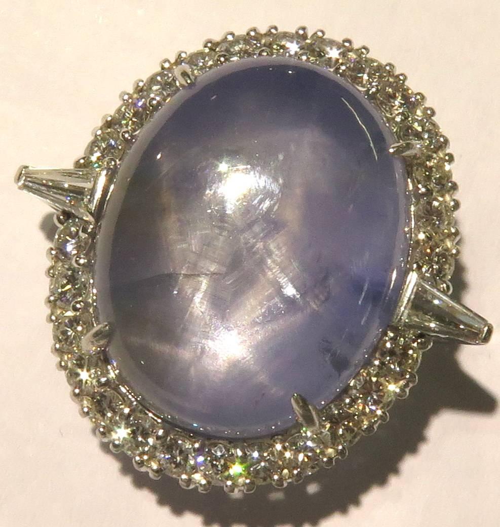 Just the size of this amazing natural star sapphire ring is enough to make you smile all day.The star measures 22.36 x 18.10 x 9.24 mm and is framed by full cut & tapered baguette-cut diamonds weighing approximately 1.75ct. t.w.
This ring is