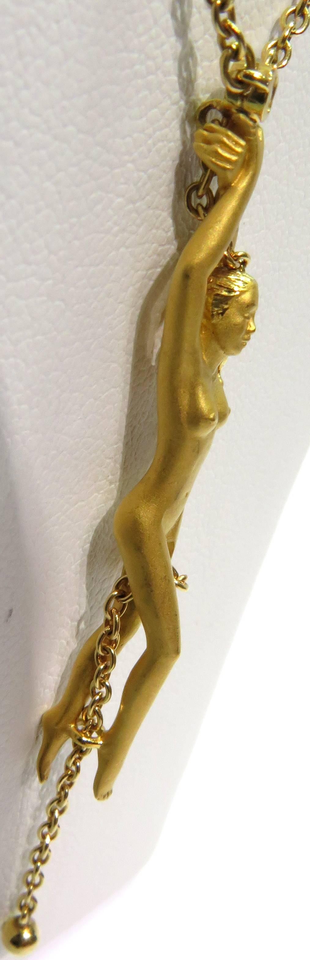 This is a wonderful example of how Carrera y Carrera shows the gracefullness in each piece. This 18k yellow gold nude is my favorite form that Carrera y Carrera makes. The chain itself measures 18 inches long. The nude attached pendant measures 2