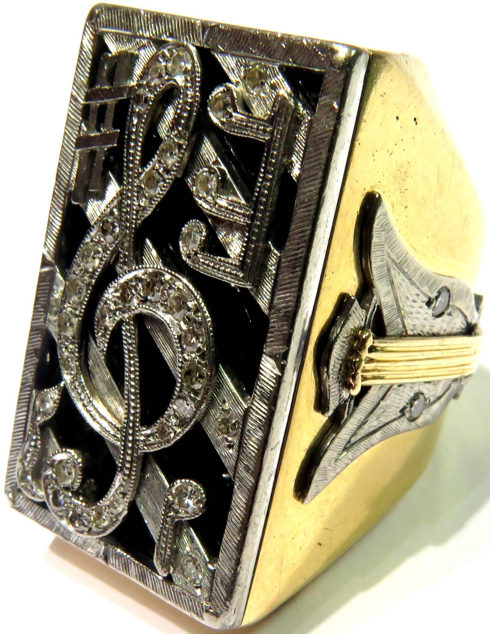 This incredibly large 18k white & yellow gold onyx diamond ring with musical symbles is completely unique. Engraved inside it says: 1o Prix Conservatiore De Musique De Paris 1952. When translated to English - 1st Prize Paris Conservatory of Music