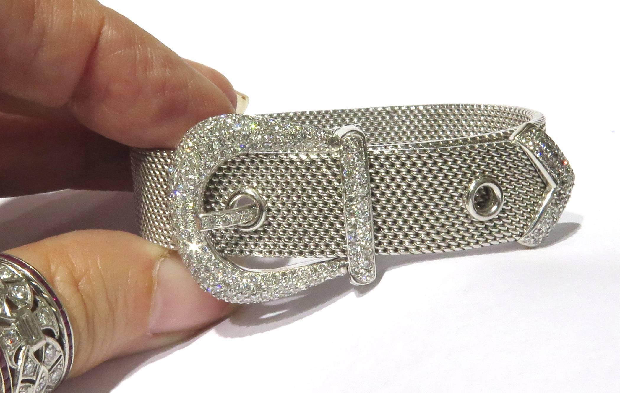 This adjustable diamond 18k white gold bracelet should be a staple in your collection. It is very comfortable and chic at the same time. Circa 1950's.
This bracelet is 9 inch long  by 1/2 inch wide.
The diamond buckle measures 1 1/8 inch wide.
This