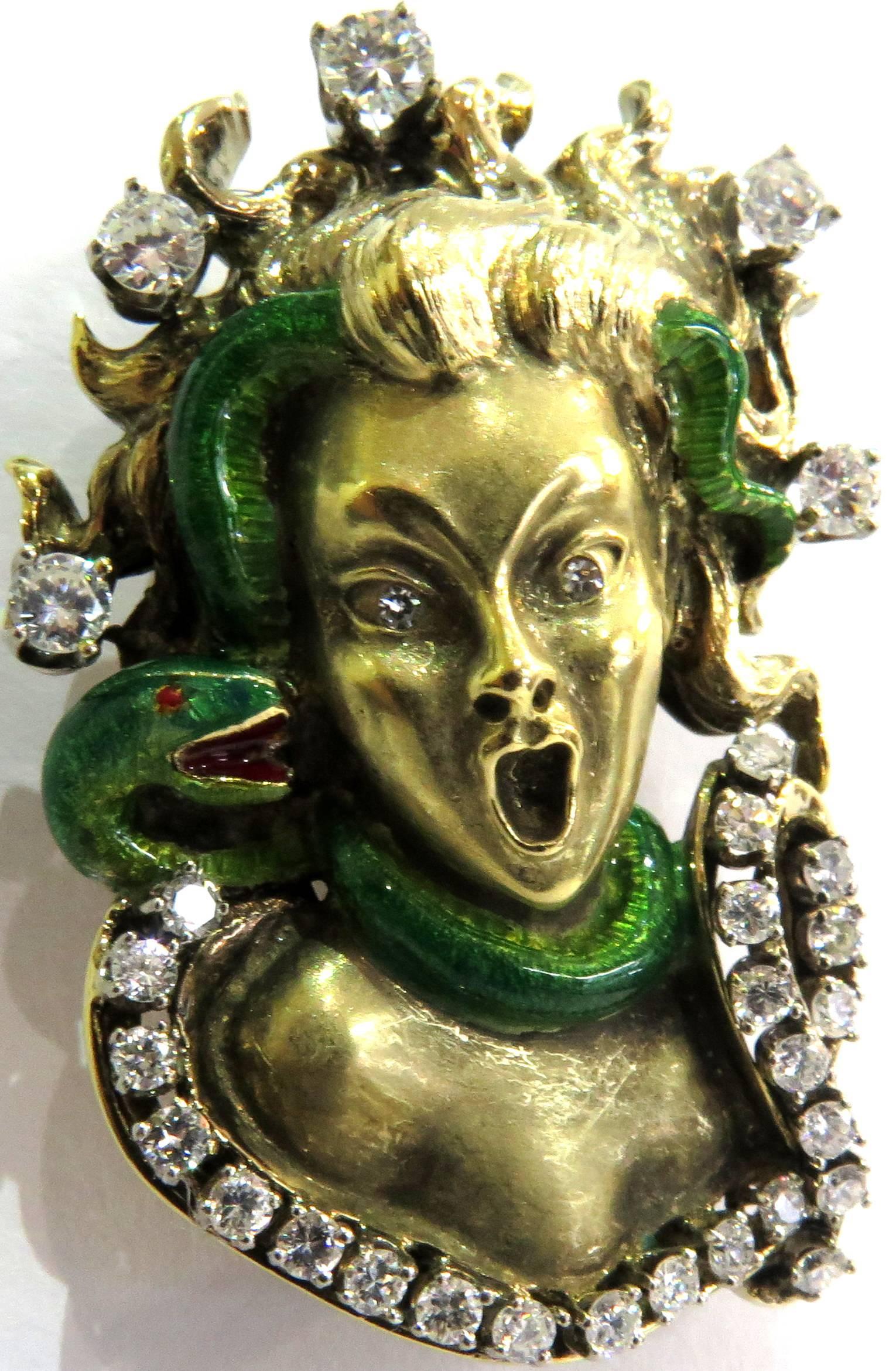 This incredible Mario Boschi Medusa pin has such extreme character. The detail is so fine it looks more like a sculpture. This pin is all 18k yellow gold with a slithering green enamel snake draping caressing around her neck, hair and face. There