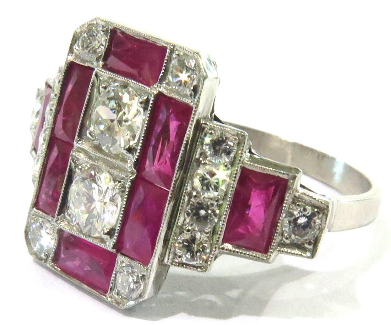 This platinum ring has such superb design. This well made ring boasts a mixture of french cut rubies plus brilliant and mine cut round diamonds all in a magnificent architectural art deco design.
This ring has approx 1.10ct diamonds and 1.50ct