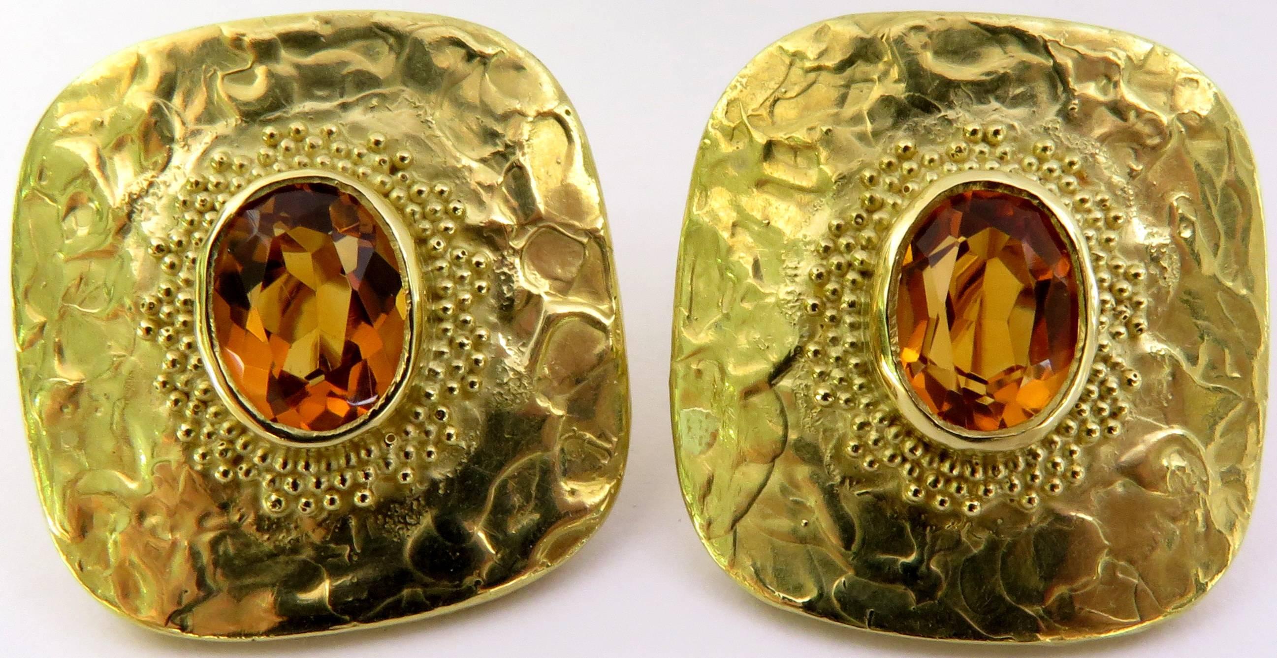 These incredible 18k yellow gold earrings feature an oval shape bezel set topaz sitting atop the earring surrounded by gold Etruscan style beading. They are comfortable to wear and have a clip back that can easily be converted to pierced if desired.