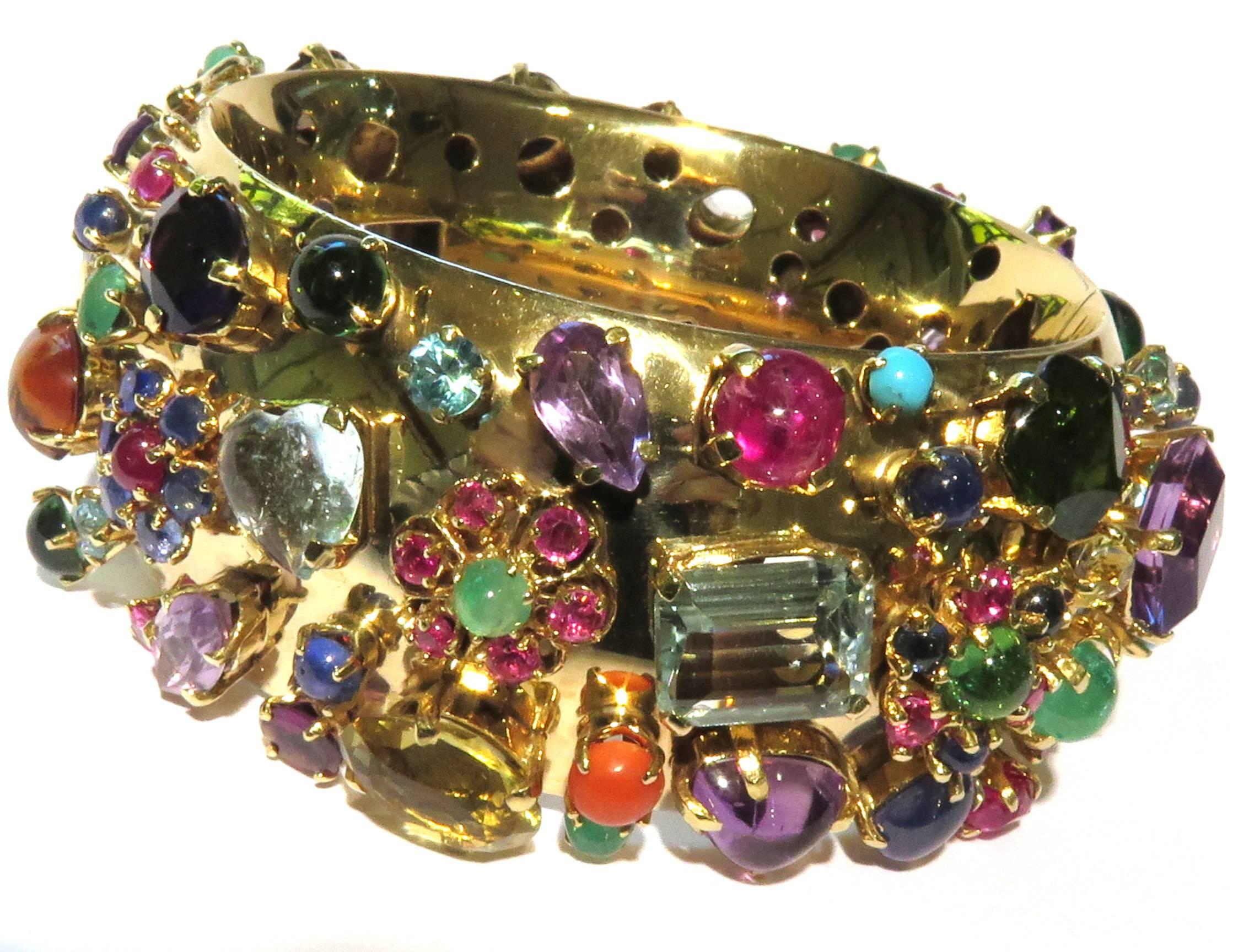 This unique 1 of a kind  bracelet has almost every precious stone in the world. Both sides are fully covered in amethysts aquamarines, rubies, sapphires, coral, tourmalines, emeralds, garnets, citrines, turquoise, etcetera in every cut & shape, all