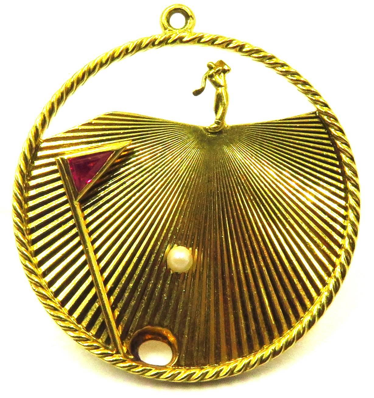 This 18K  3-D Tiffany Golf charm or pendant has so much action going on, you feel as though you are standing at the hole watching the ball go in. It is a round disk charm with a rope design around perimeter. This is perfect for anyone who