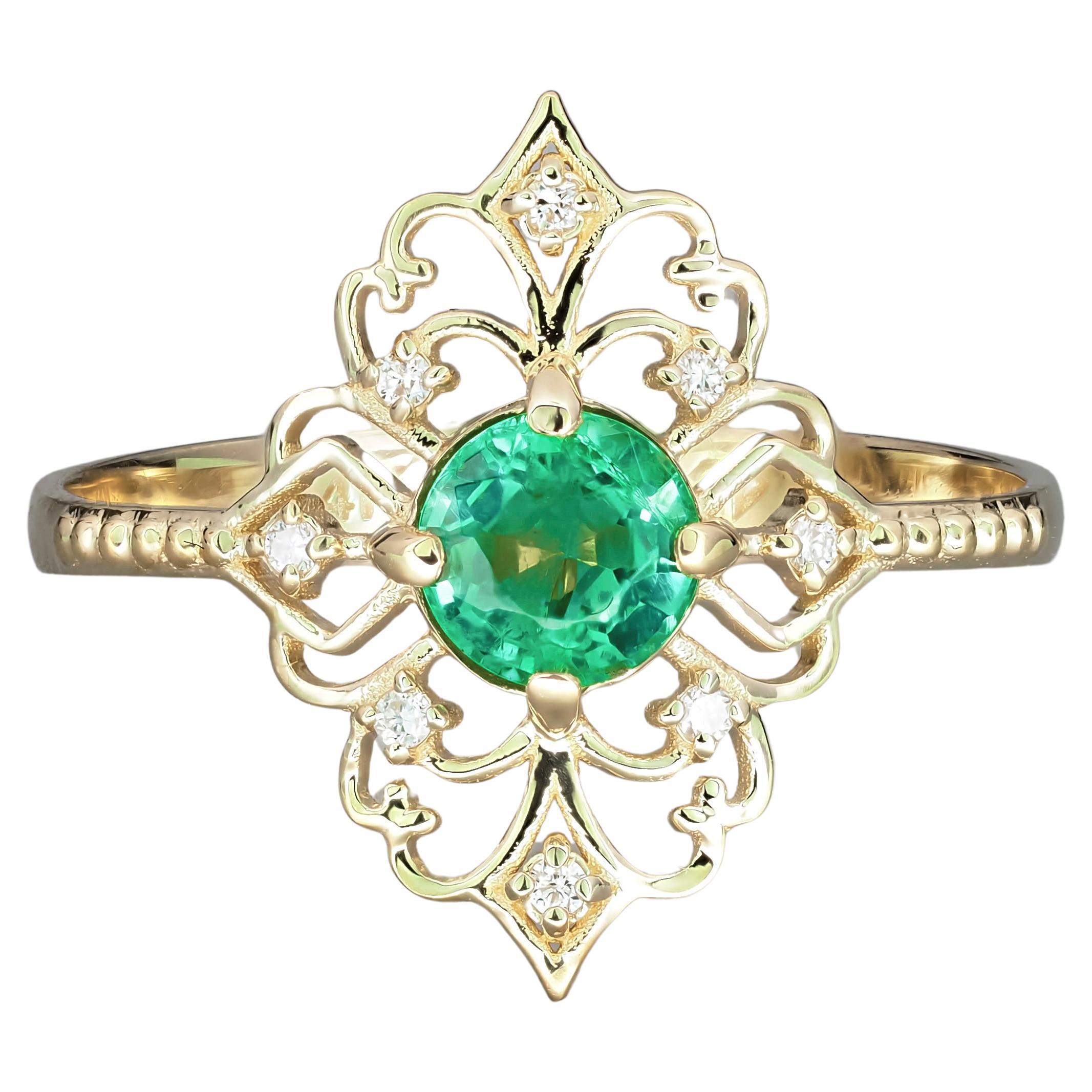 For Sale:  14 K Gold Ring with Emerald and Diamonds