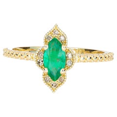 14k Gold Ring with Marquise Cut Emerald and Diamonds
