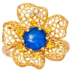 Sapphire cabochon 14k gold flower ring.
