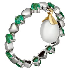 Vintage 14 Karat Gold Eternity Ring with Emeralds and Pearl. Emerald eternity ring