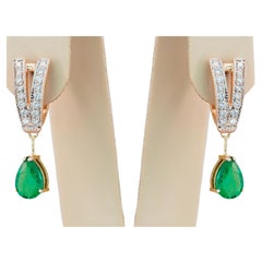 Boucles d'oreilles en or 14 carats avec émeraudes en poire et diamants