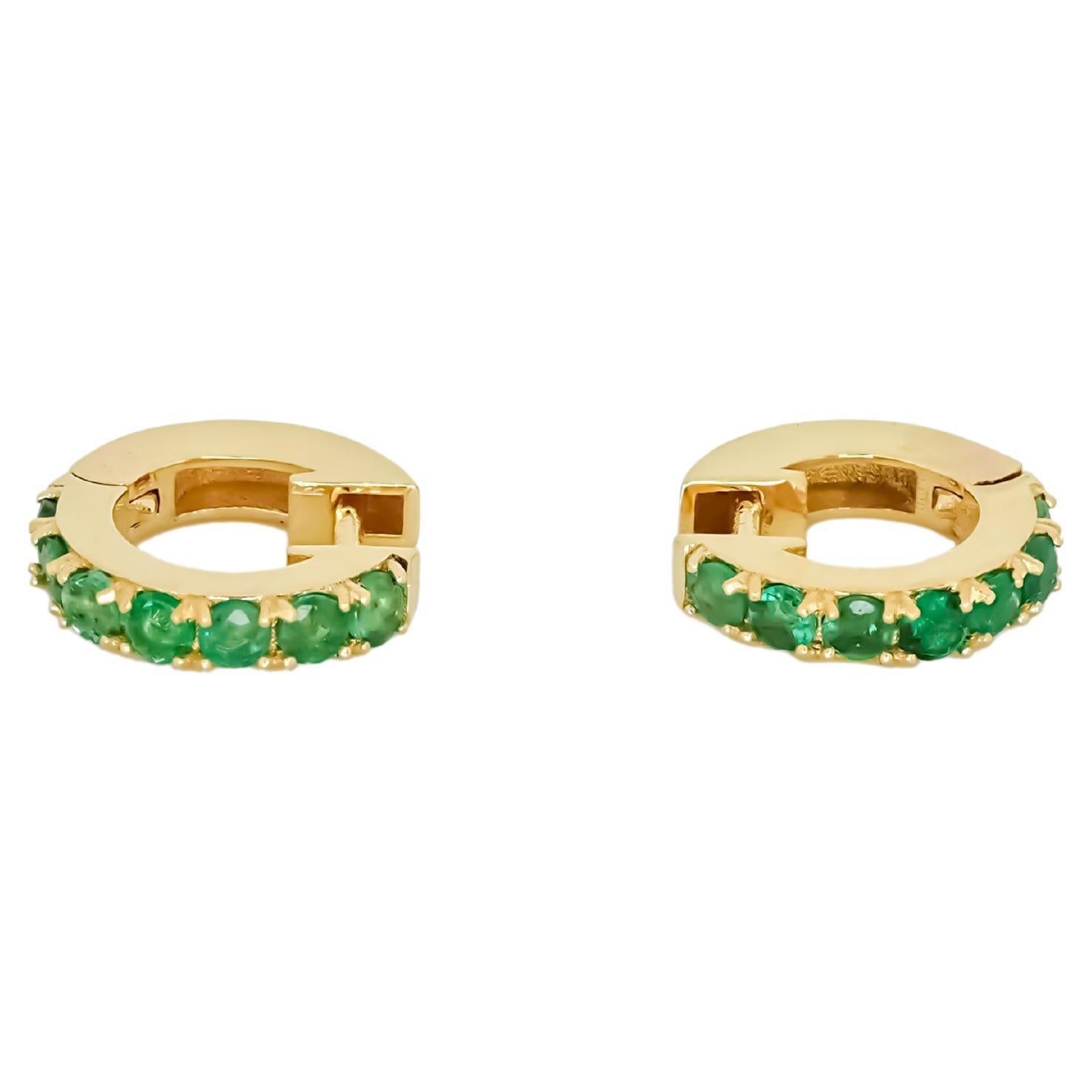 Hoop Earrings with Emeralds, Huggy Hoop Emerald Earrings in 14 Karat Gold For Sale