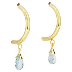 Pendientes de aro con gota de topacio en oro amarillo de 14k