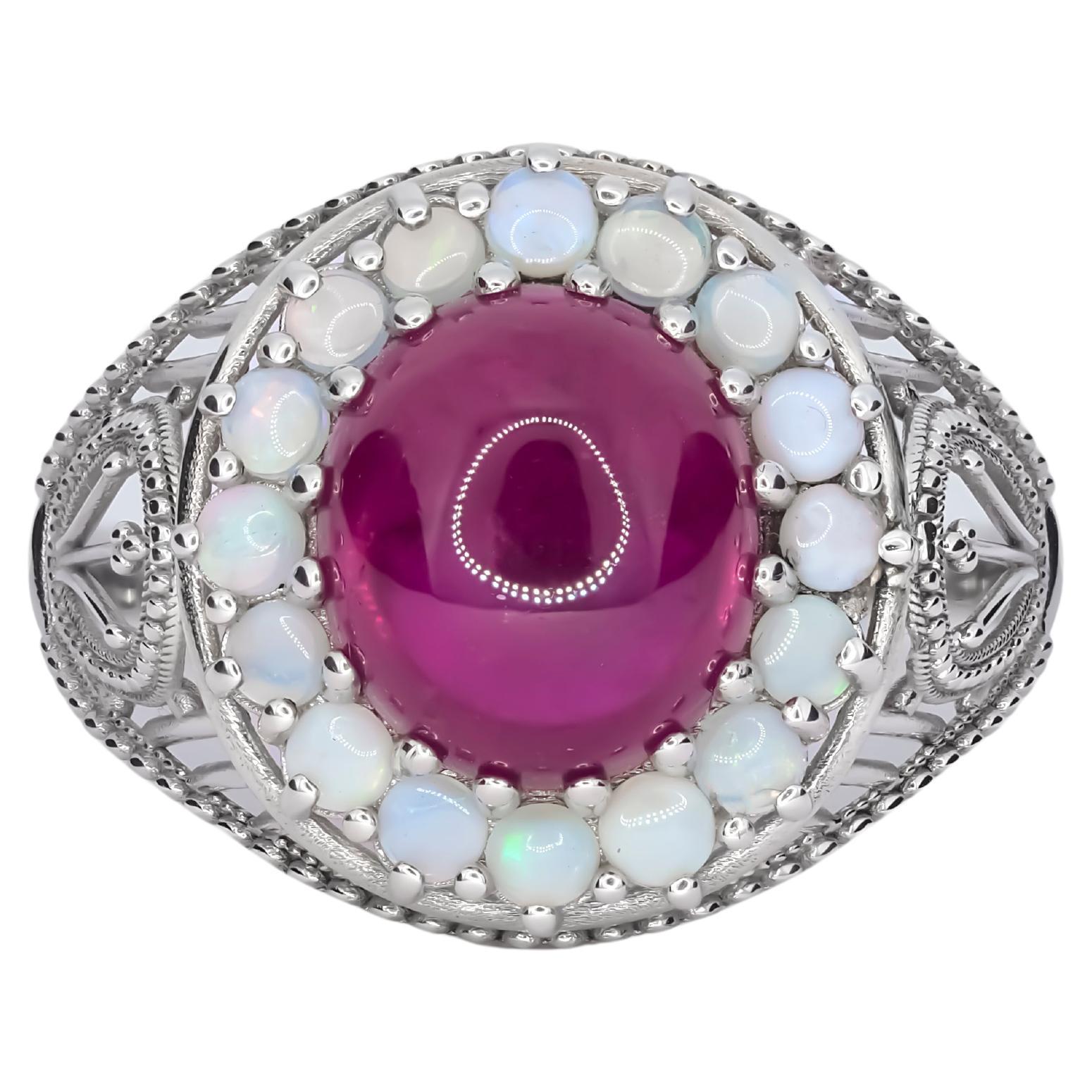 in vendita:  Anello massiccio di rubini e opali