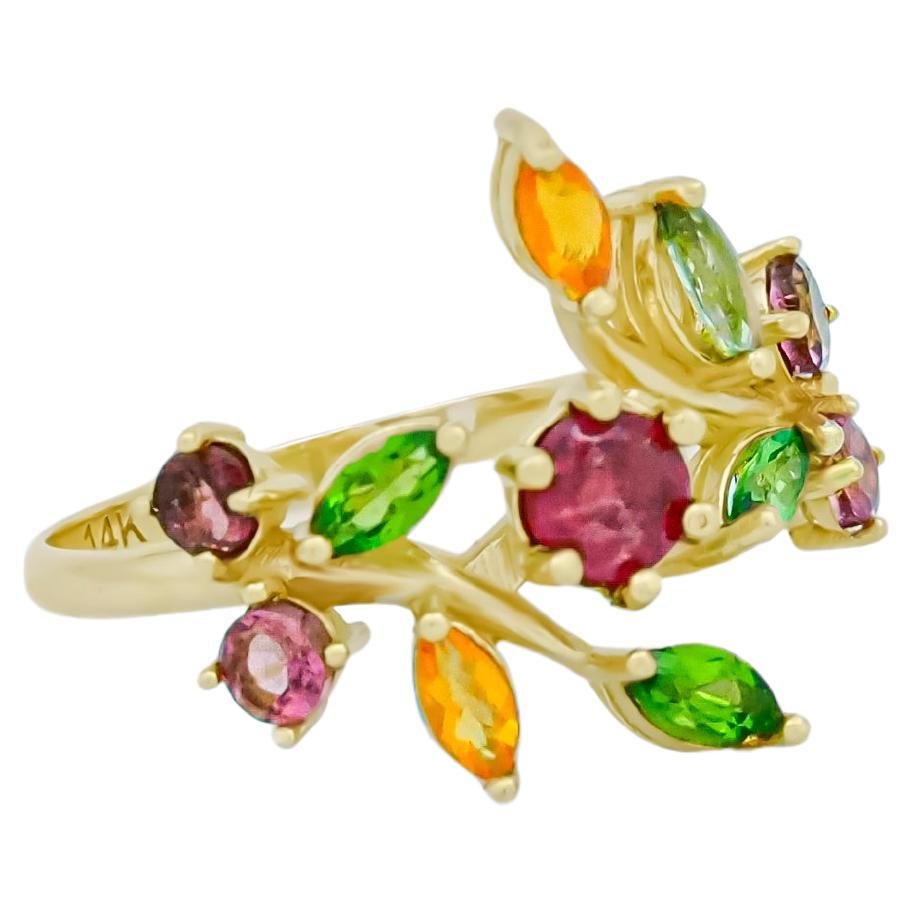 14 k gold ring with ruby, tourmalines, sapphires  - Multicolored Gemstone Rings
Metal type: Gold
Metal stamp: 14k Gold
Weight: approx. 2.24 g

Gemstones: 
Central stone: Ruby
Cut: round
Weight: approx 0.45 ct. total.
Color: Red
Clarity: Transparent