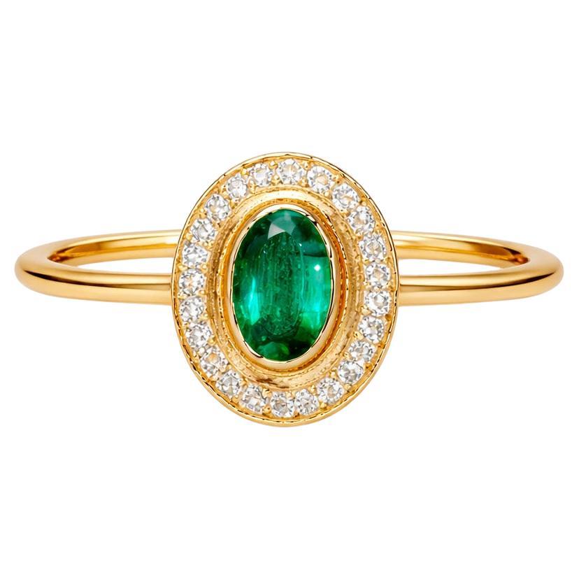 Bague en or 14k, émeraude et diamants.