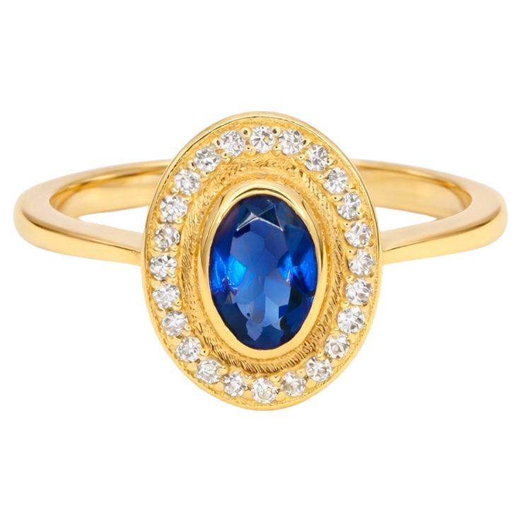 Ring aus 14-karätigem Gold mit Saphiren und Diamanten.