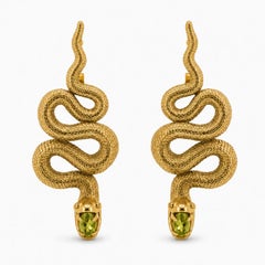 Massive Snake earrings with peridots in opened mouth