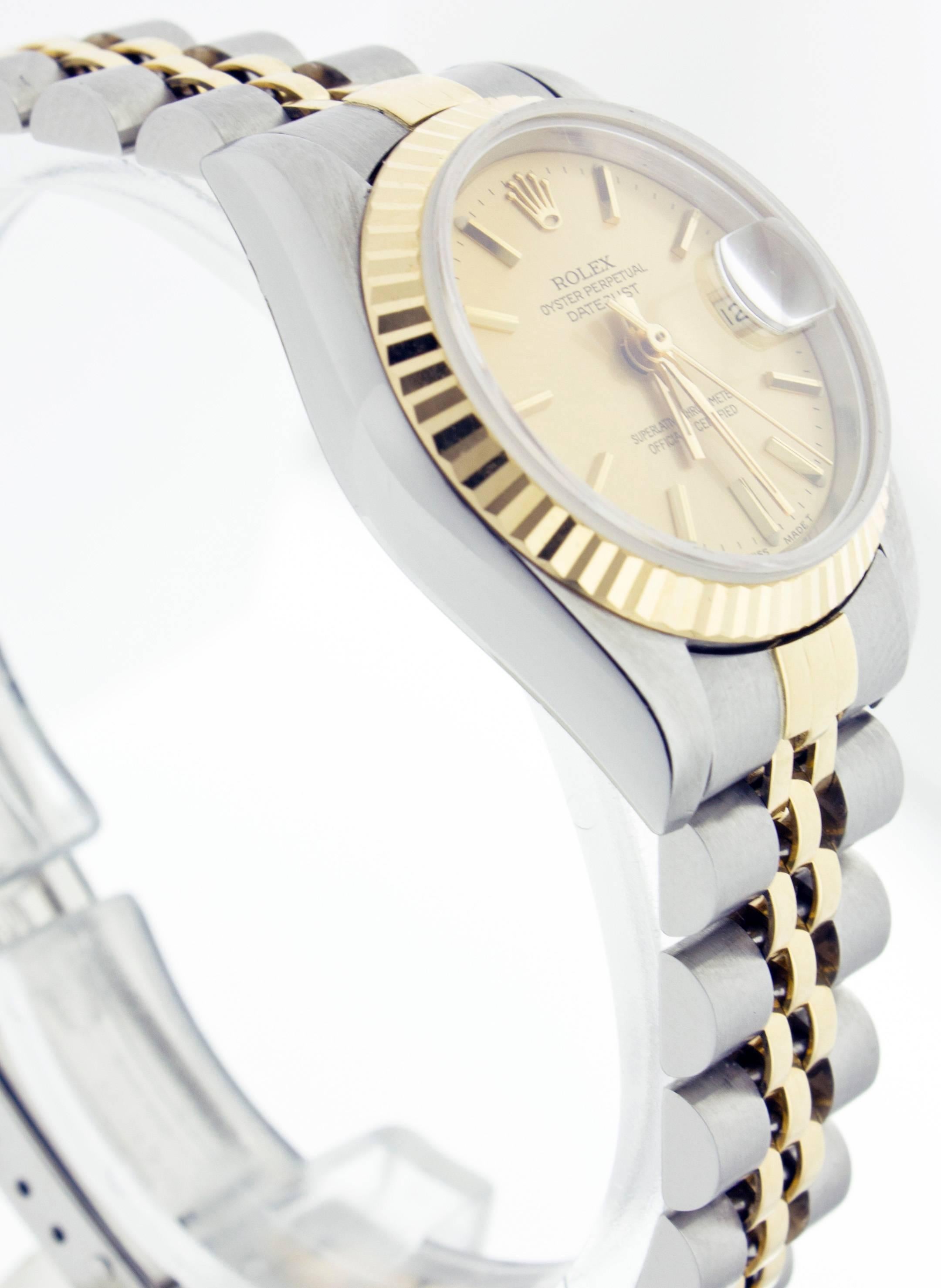 Brand: Rolex
Model: Datejust 69173
Case: Rolex Two Tone 26mm
Bezel: 18K Yellow Gold Fluted
Dial: Champagne Index 
Bracelet: Rolex Two Tone Jubilee (Yellow Gold & Stainless Steel) 
Bracelet Length: Will Fit Up To 6