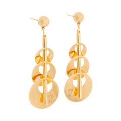 Boucles d'oreilles en or jaune 18 carats avec disques concentriques de tailles différentes