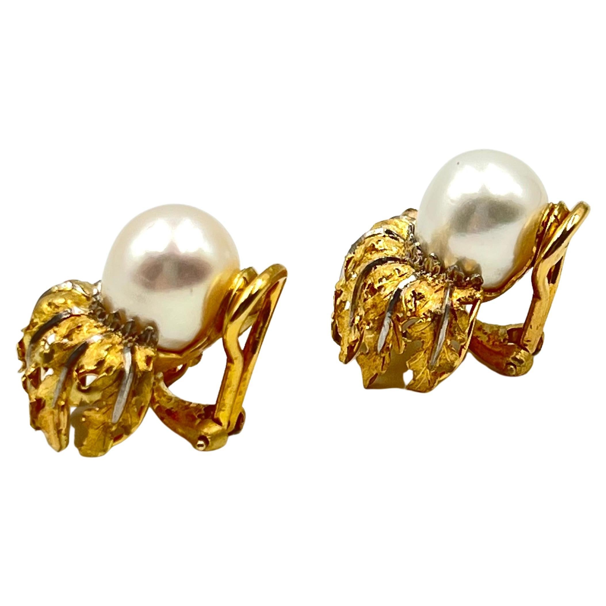 Buccellati 18kt yellow brushed gold leaf design.  Set on top of each is a South Sea cultured pearl measuring approx. 10.48-10.60mm.  0.9