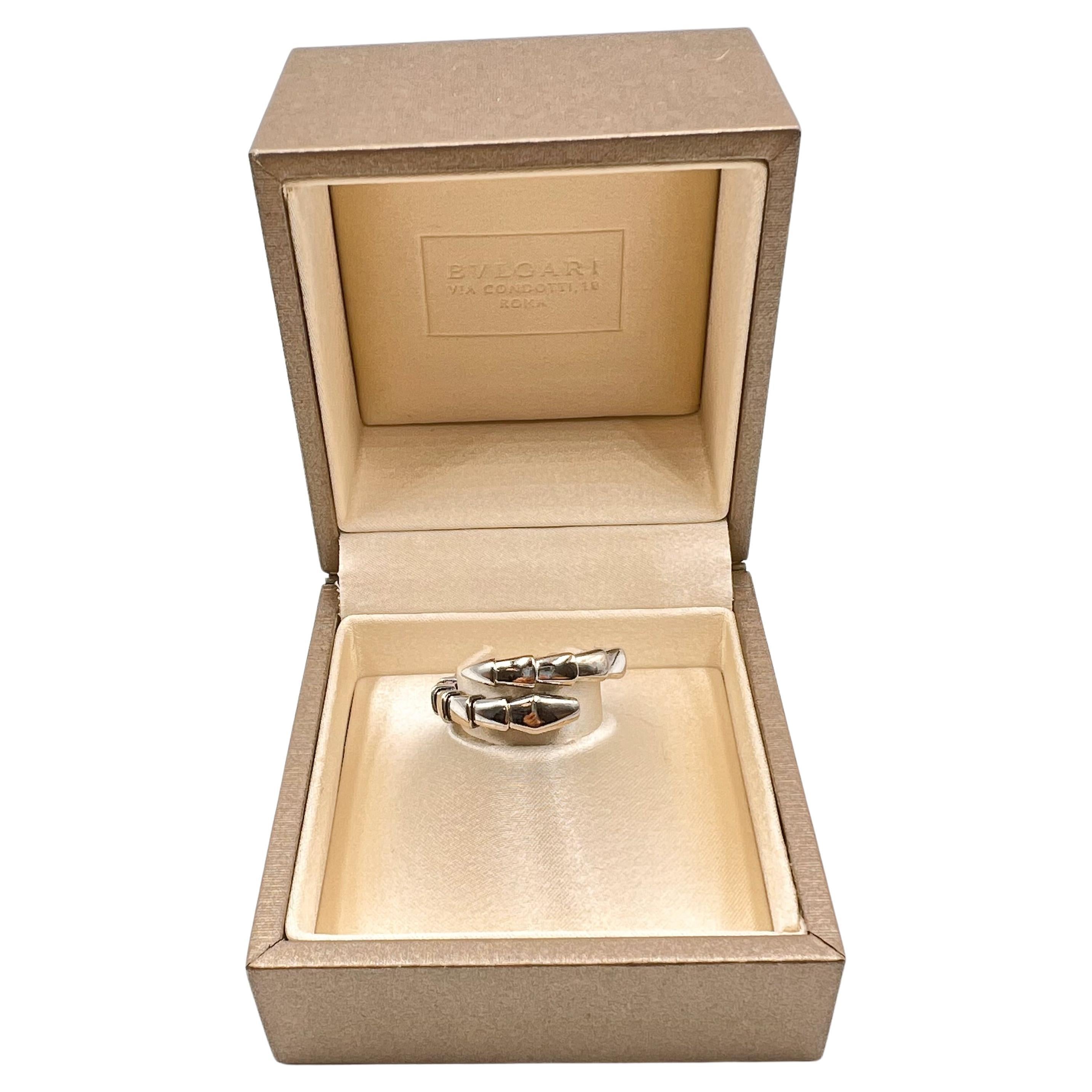 Bvlgari Serpenti Viper band ring crafted in polished 18 karat white gold. The serpentine design coils around the finger in a flexible wrap style. Polished tapered serpenti sections open at the ends to allow the ring to be worn by various finger