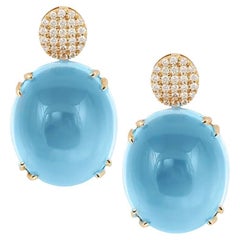 Goshwara, pendants d'oreilles en or 18 carats avec topaze bleue et diamants