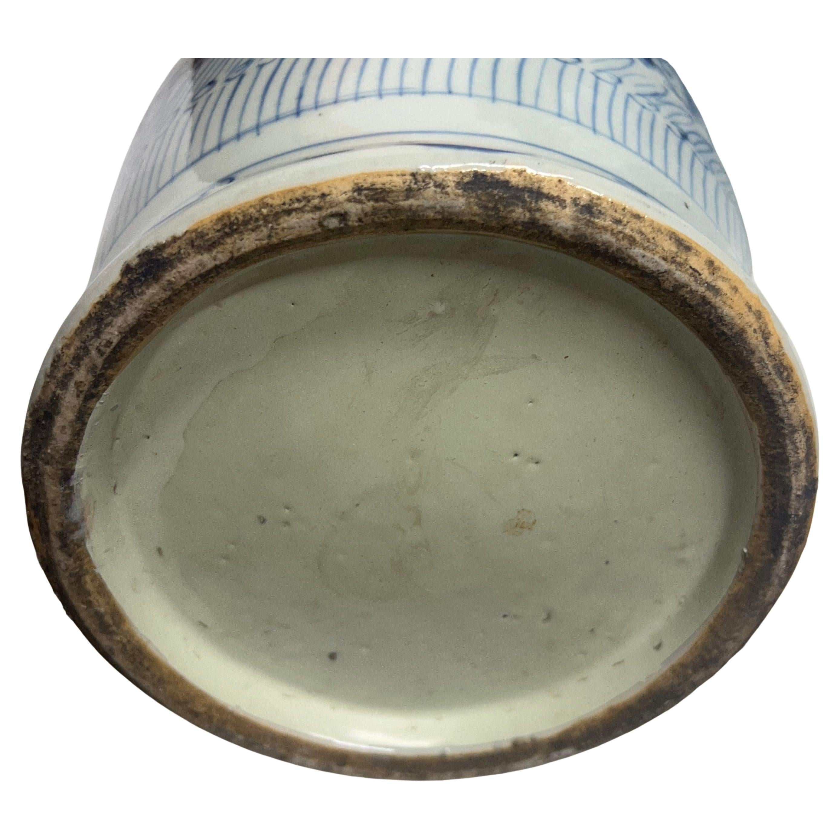 Pair of antique Chinese blue and white porcelain happiness vases, circa the 19th-20th centuries.  Hand-painted and slightly different than each other, featuring a tapered neck with handles and bulbous body.  The vases are decorated with a pattern of